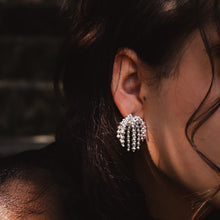 Load image into Gallery viewer, Teuila Fatupaito Starburst Studs in 18k gold plated stainless steel, side angle view showing dimensional starburst pattern