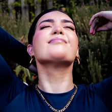 Load image into Gallery viewer, Teuila Fatupaito Flux Studs being worn, showcasing how the 18k gold plated earrings complement facial features