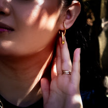 Load image into Gallery viewer, Teuila Fatupaito Flux Studs worn by model, highlighting the earrings' size and proportion on the ear
