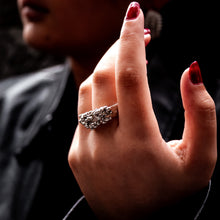 Load image into Gallery viewer, Hand with a decorative ring on a dark background - Teuila Fatupaito Jewellery