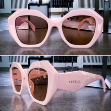 Load image into Gallery viewer, Teuila Fatupaito Honeyz sunglasses, close-up detail of geometric frames and UV400 protective lenses with
pink frames.