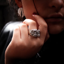 Load image into Gallery viewer, Close-up of a hand wearing a silver ring with a blurred background Teuila Fatupaito Plerogyra Ring Series - Signet style in 925 sterling silver.

